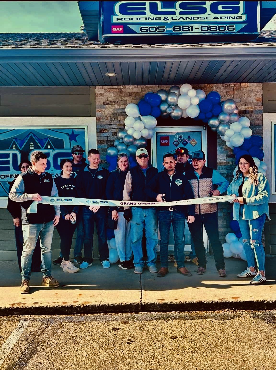 Grand opening day at our Watertown office: the ribbon, the balloons, and the people who made it real.